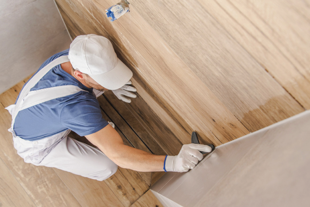 how to install a shower base on a wooden floor